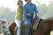 miley cyrus and lucas till on a horse