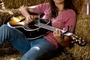 miley cyrus plays guitar